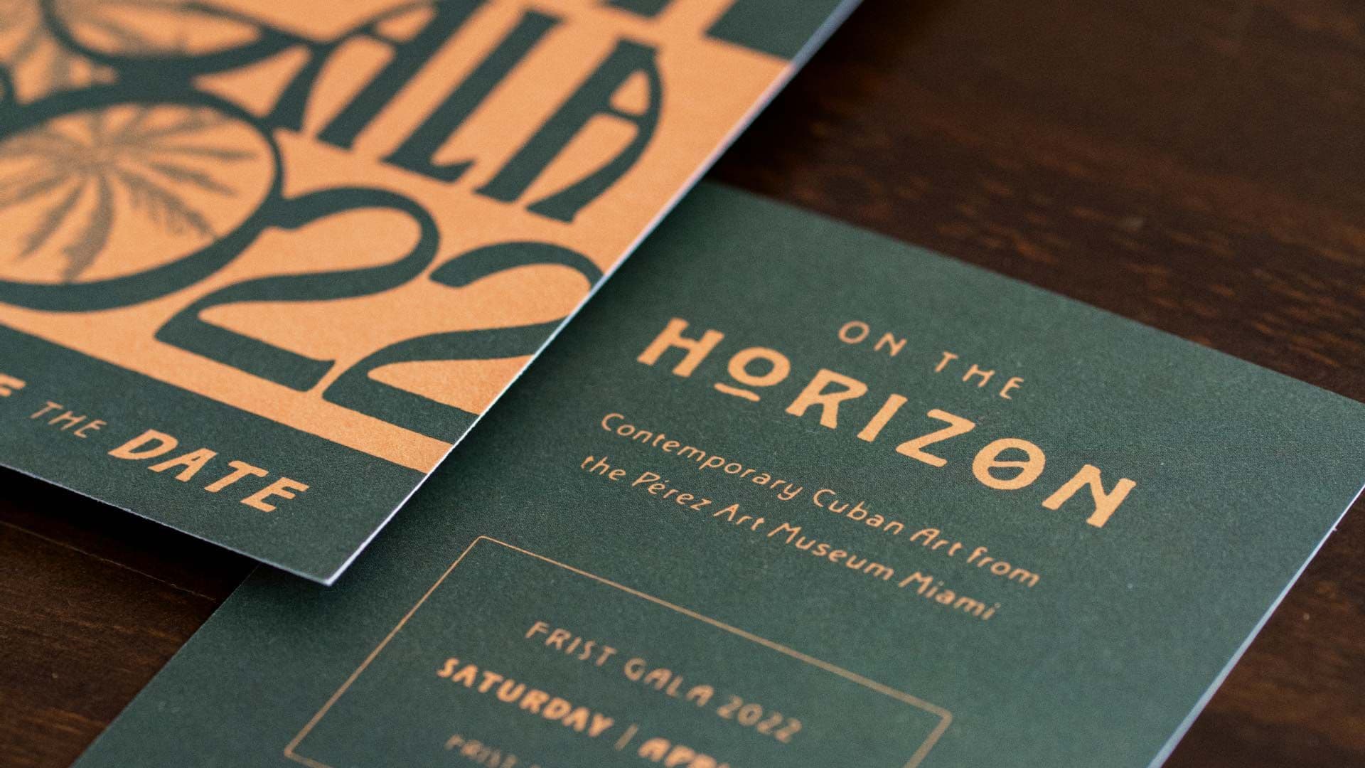 Photo of the 2022 First Gala Save the Date on a dark wood background