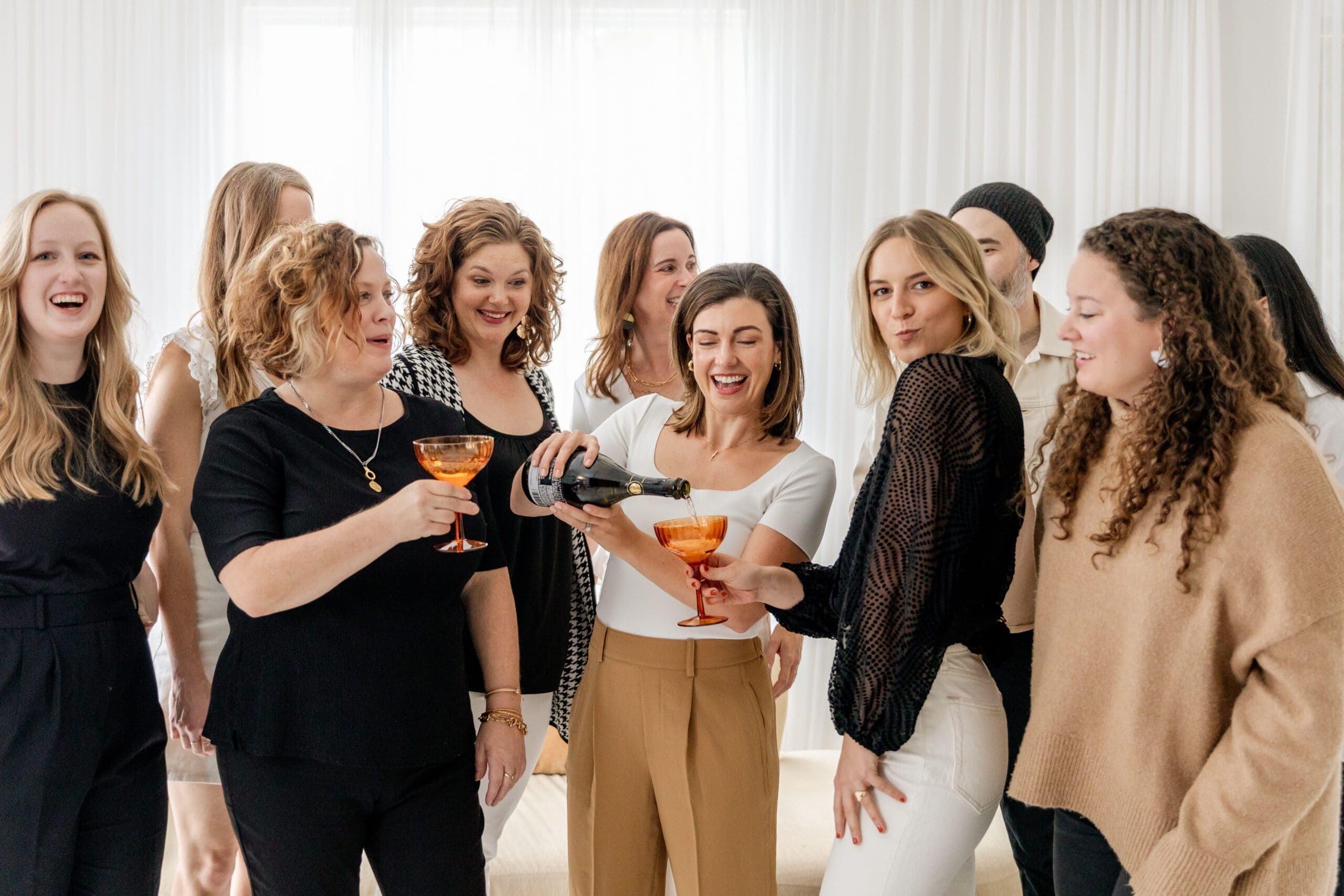 Circa team celebrating with champagne