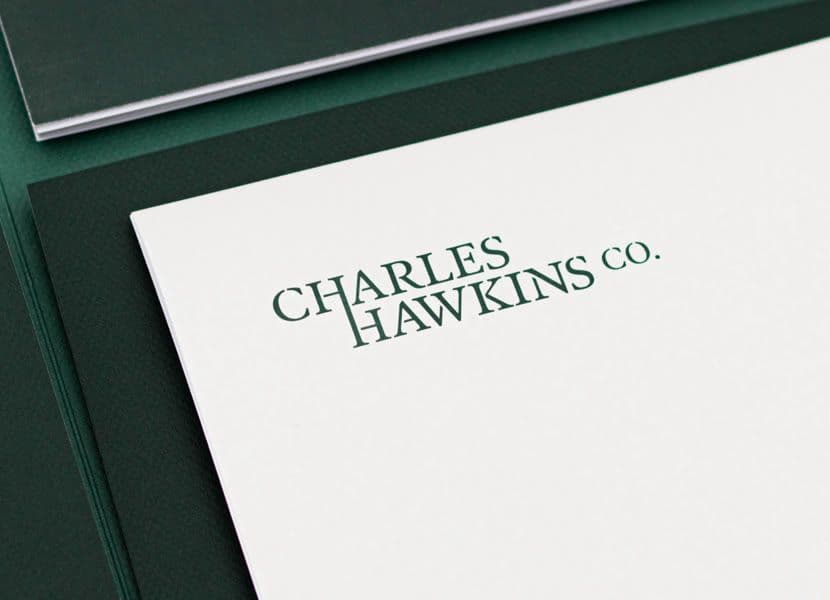 Charles Hawkins Co. letterhead with the green logo on deep green stationery