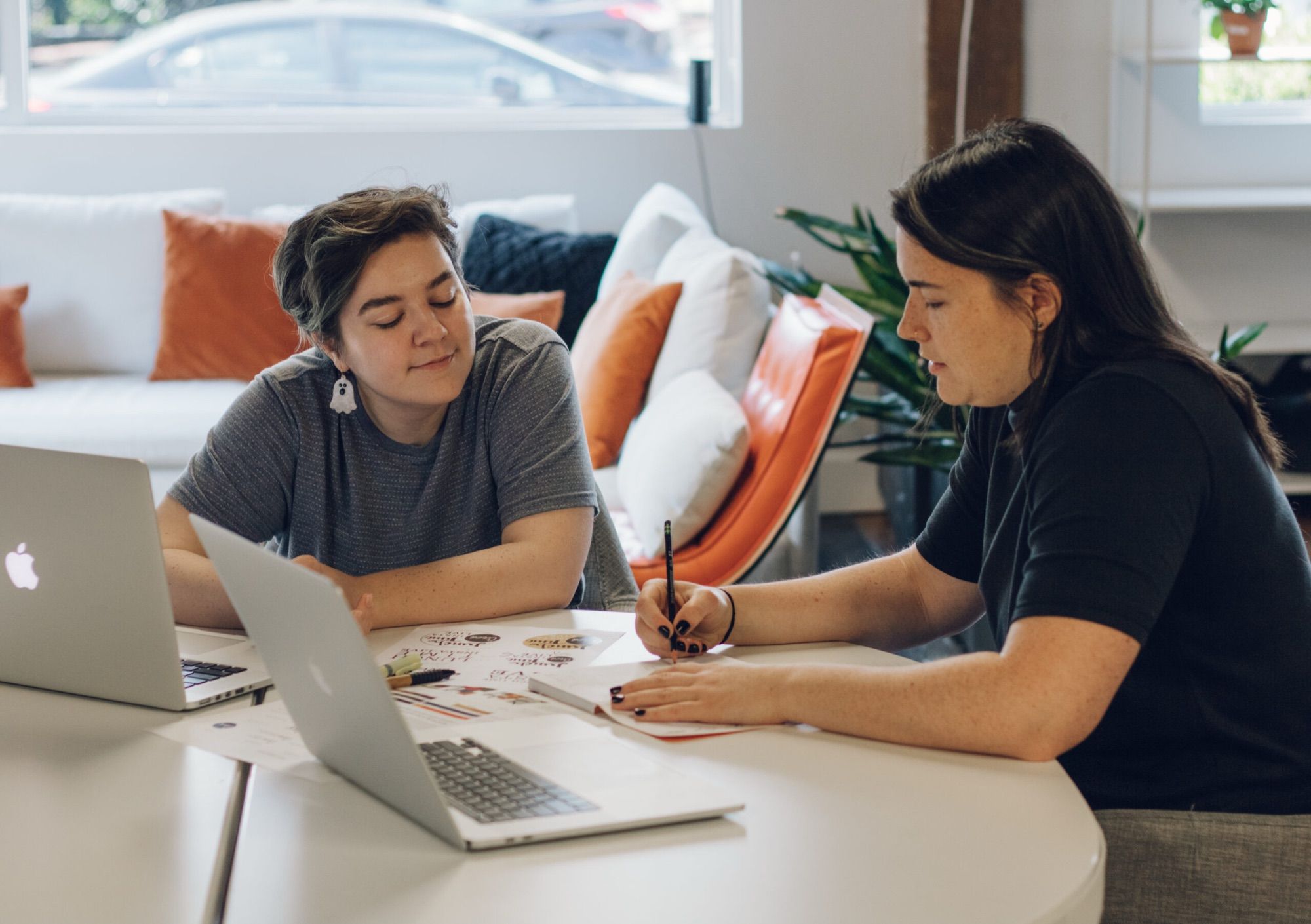 Two Circa Fellows working at a desk