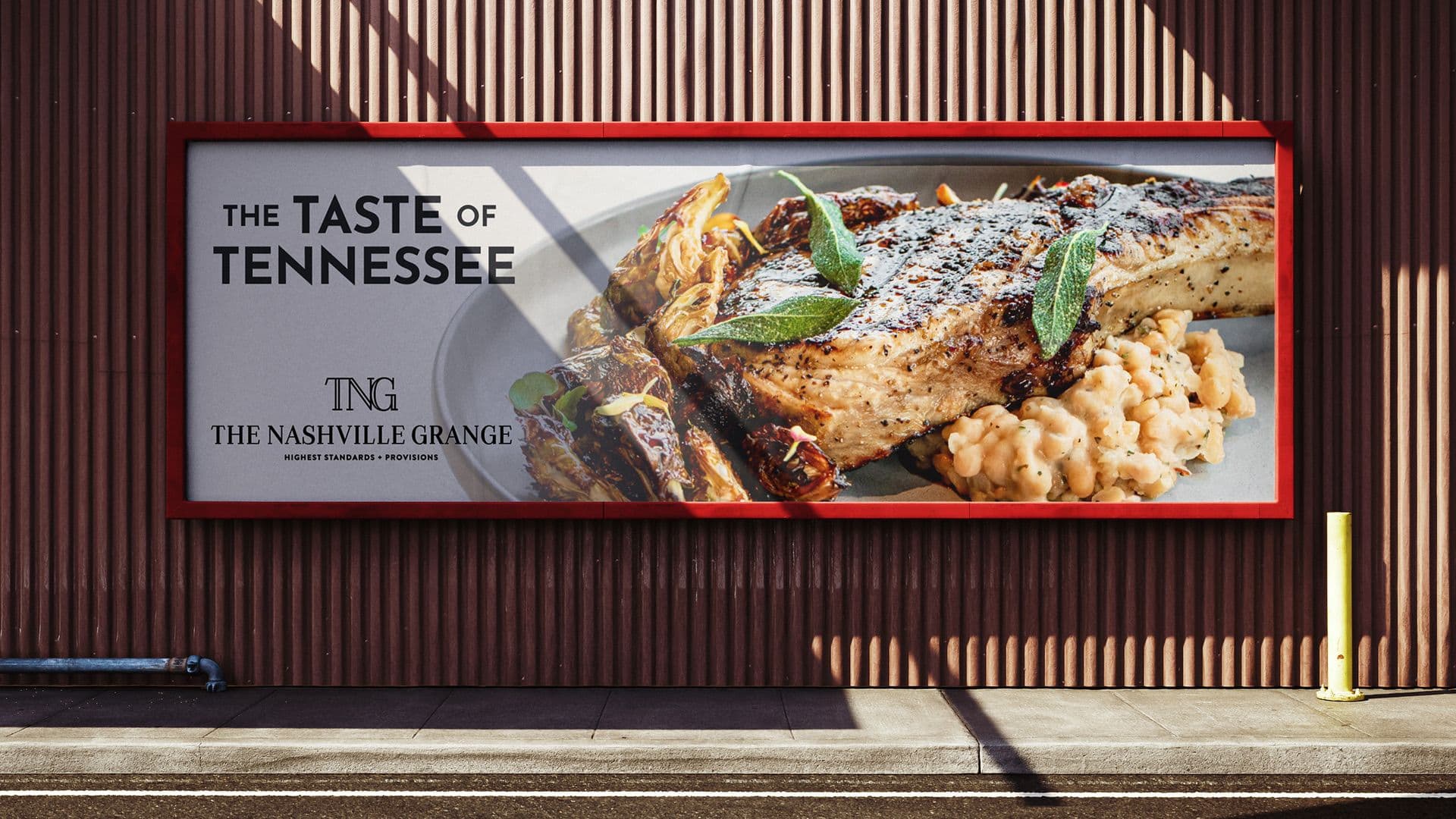Outdoor signage for The Nashville Grange restaurant showcasing a gourmet steak and potato dish.
