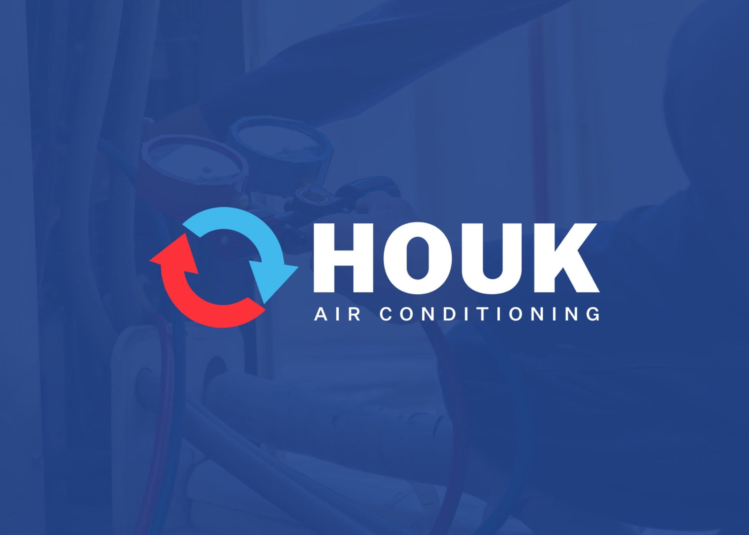 Houk Air Conditioning logo on a blue photo of an HVAC technician at work