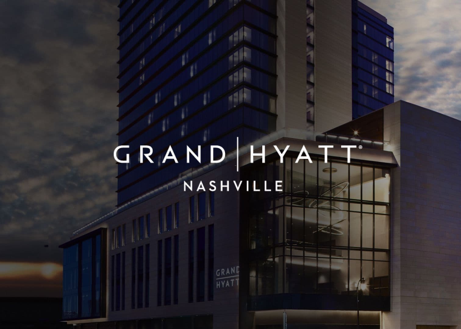 Minimalist white-out version of the Grand Hyatt Nashville hotel exterior with black logo centered.