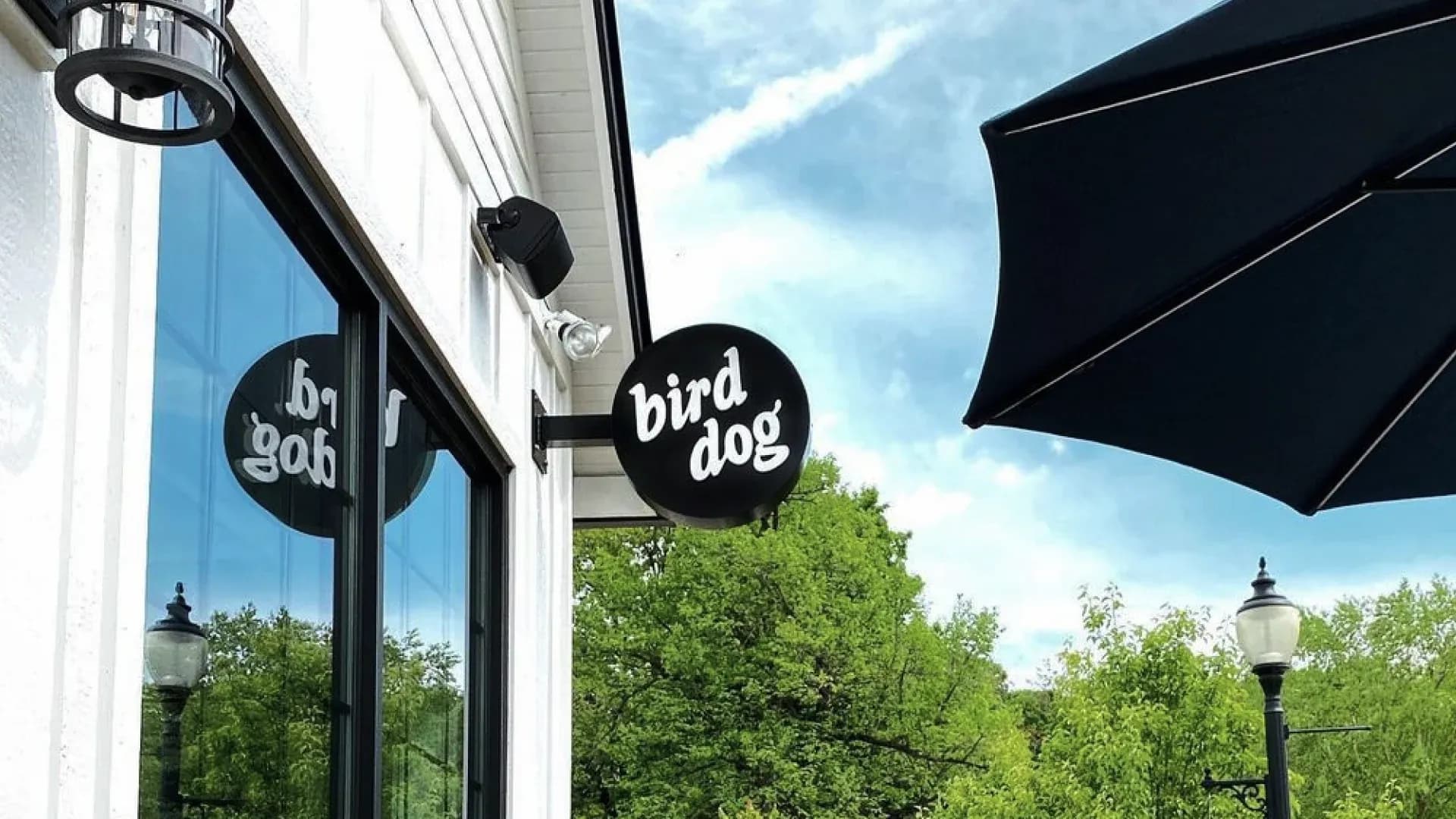 Bird Dog restaurant logo on an outdoor sign
