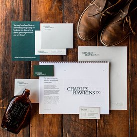Charles Hawkins Co. stationery on a wood desk