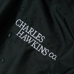 Charles Hawkins Co. logo embroidered on dark fabric
