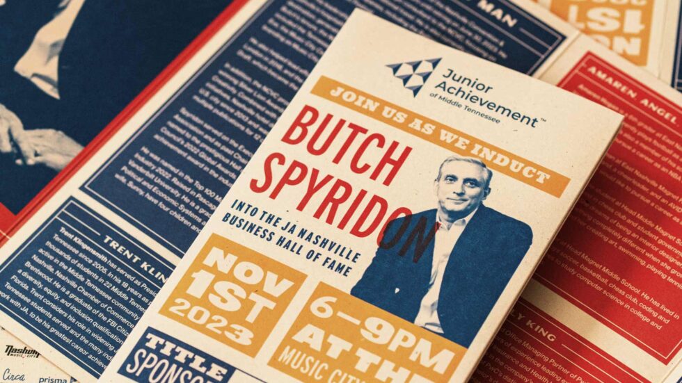 Zoom in of a folded brochure of the JA event honoring Butch Spyridon